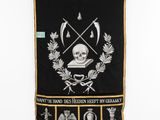 an image of a banner with a skull on it hanging on a wall
