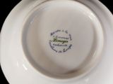 a white plate with a blue and green design on it