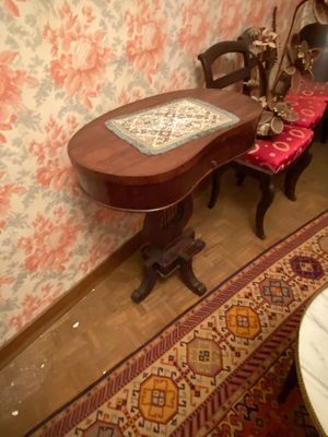 an image of a dining room with a table and chairs