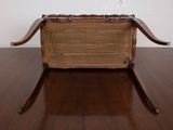 a wooden box with a handle on a wooden table