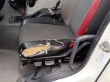 a picture of a car seat with a broken arm rest