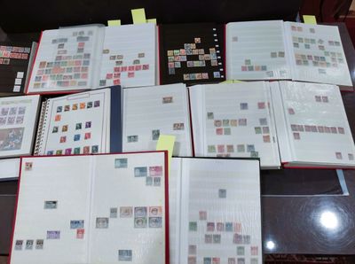 a lot of stamps on a table with a lot of them