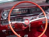 dashboard of a classic car with red leather seats and a red steering wheel