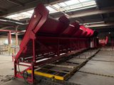 a large red machine that is sitting in a building