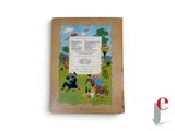 an old children ' s book with a picture of a boy and a girl in a field