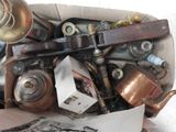 a box full of old copper pots and pans