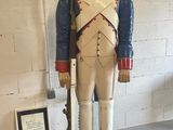 a statue of a soldier with a rifle in a room