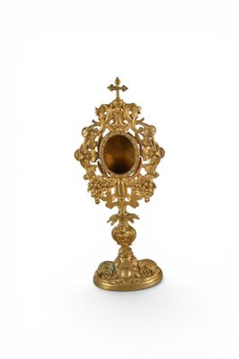 an image of a gold colored clock on a white background