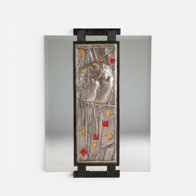 an image of a metal plaque with a picture of a woman on it