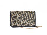 a black and gold purse with a chain strap