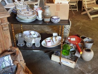 a table with plates and bowls on it in a room