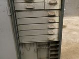 a metal cabinet with five drawers inside of it