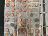 a book with a bunch of coins inside of it