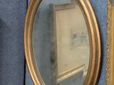 a picture of a painting and a mirror on the wall