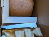 a cardboard box with a cake inside of it