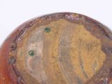 a close up of a vase with a brown base