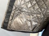 a close up of a jacket on a mannequin mannequin