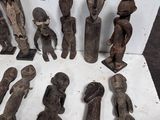 a lot of wooden figurines sitting on a table