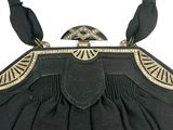an image of a black purse with gold trimmings and a bird on top of it