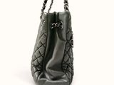 an image of a black purse on a white background