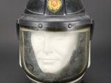 a mannequin head wearing a fireman ' s helmet