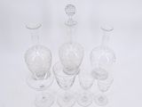 a lot of empty wine glasses on a white table