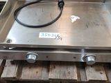 an image of a stainless steel stove top on a pallet in a warehouse