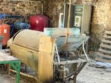 a man that is working on a machine in the dirt