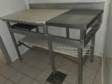 a small table with a shelf on it in a kitchen