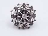 a close up of a ring on a white surface
