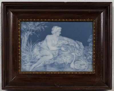 framed blue and white picture of a naked man sitting on a rock