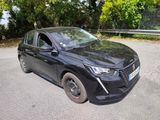 a black car that is parked on the side of the road