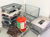 a fire extinguisor and a stack of crates in a room