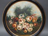 une image représentant un tableau de fleurs dans un cadre noir et doré