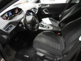 the interior of a car with black leather seats and dashboard controls
