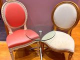two chairs and a table in a room