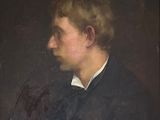 portrait of a young man in a black suit and white shirt