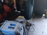 an image of a vacuum and other equipment in a garage