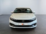 the front of a white car is parked in a large room