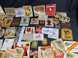 many different types of vintage cigar labels on the table