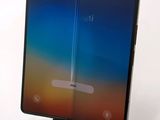 an image of a close up of a tablet with a curved screen