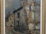 tableau représentant un vieux bâtiment, encadré et accroché au mur