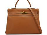 a brown leather handbag on a white background