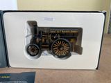 a small model of a steam engine in a box