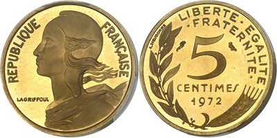 a close up of a coin with a woman ' s face on it