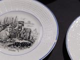 two plates with a picture of a castle on them