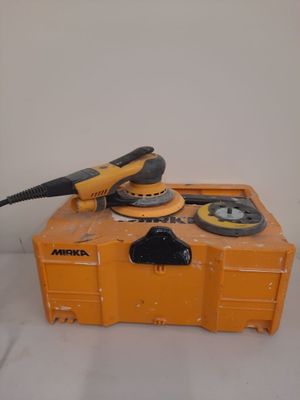 an image of a tool box with a sander on top of it