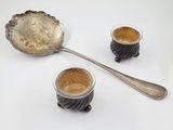 two cups of coffee and a spoon on the table