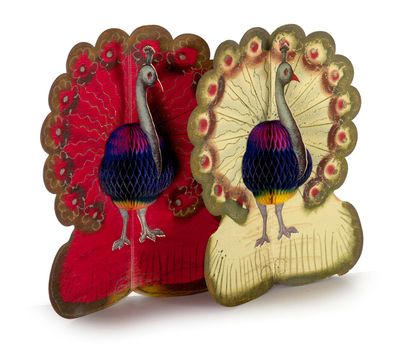 two decorative figurines of a peacock on display