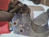 a close up of a pair of pliers on a table